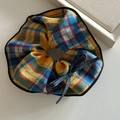 Detail of checkered mango yellow scrunchie with bow decoration and premium fabric texture - Large Black Edge Yellow Blue Scrunchie Dark Blue Bow