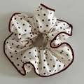 Close-up of cream scrunchie with red polka dots and matching stitched edge details - Off-White Hair Scrunchie with Red Polka Dots