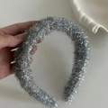 Detail shot of the silver shimmering texture on a flexible metal headband for women - Silver Shiny Thread Headband