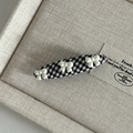 Detail of British style houndstooth hair clip with three white 3D resin bows - Small Black White Grid Oval with Three White Bows
