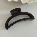 Detail of amber translucent large shark hair claw clip with strong black metal spring - 13# Large Hollow Arc Claw