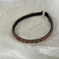 Close-up detail of coffee brown braided headband with non-slip teeth for secure grip - Coffee