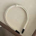Detail of cream multi-strand knotted PU leather headband with comfortable black protective tips - White