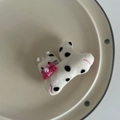 Close-up of plush cat ear hair clip with polka dots, pink bow, and pearl details - White Cat Black Polka Dot Clip