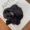 Black satin scrunchie with red heart patterns and a handmade label for ponytails - Black Scrunchie Red Heart (12#)
