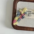Detailed macro view of the colorful tweed fabric texture on the woven metal hair clip - Blue Red Plaid Woven Seamless Clip