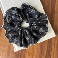 Elegant black lace polka dot scrunchie with white floral pattern and wavy stitched edge - Black Mesh Hair Tie with White Edge Floral