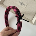 Close-up of pink checkered headband with heart patterns and black satin bow detail - Rose Red Black Plaid Bowknot Headband