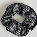 Detailed view of large houndstooth plaid scrunchie with soft knit fabric and black piping - Large Black and White Houndstooth Bow Scrunchie