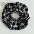 Macro shot of large plaid scrunchie with bow pattern and black stitched edge details - Large Black and White Stripe Scrunchie