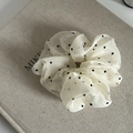 Detailed texture of polka dot organza hair scrunchie on a decorative book surface - Off-White (1#)