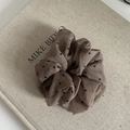 Elegant brown polka dot organza hair scrunchie shown on a textured linen background - Khaki (2#)