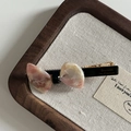 Pink marble texture bow hair clip with gold Barrette La France lettering on wood tray - Pink White Texture Bow Duckbill Clip