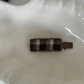 Detail view of a vintage plaid fabric hair clip with a stylish wavy edge frame - 1# Coffee Checkered Duckbill Clip