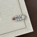 Macro detail of white enamel hair clip with red polka dots and cherry rhinestone decor - White Red Dot Oval Hollow Red Cherry