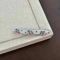 Detailed view of cherry hair clip with pink crystal rhinestones and red polka dots - White Red Polka Dot Curved Pink Cherry