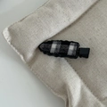 Detail of checkered hair clip with wavy edges on rustic beige linen background - Black and White Plaid Water Drop Hair Clip