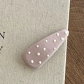 Close-up of a purple polka dot teardrop hair clip on a textured linen background - Pink Hair Clip White Polka Dot