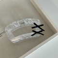 Detailed view of pink lace pattern on clear acrylic hair claw with black bows - White Square With Double Black Bows