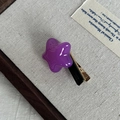 Macro view of purple star-shaped acetate hair clip with FRANCE Handmade engraving - Purple