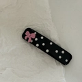 Close-up of pink bow and white polka dots on a glossy black hair clip detail - Black White Polka Dot Square Pink Bow