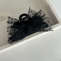 Detail of elegant black mesh bow hair claw with polka dots on a light grey tray - 5# Black Mesh Polka Dot Bow Hair Claw