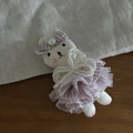 Detail of plush white rabbit hair clip with knit texture and pink striped ballet skirt - Double Layer Pink Skirt Pearl Rabbit Hair Clip
