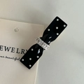 Detail of polka dot bow hair clip with crystal accents and black resin finish - Black Bowknot White Dots