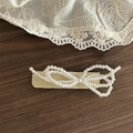 Detailed close-up of woven rattan hair clip with a multi-layered pearl bow design - Creamy White Square Double Bowknot