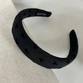 Detail of black padded headband with velvet bow and handmade label on fabric - Black Black Bow (3cm)