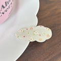 Detailed close-up of a floral cloud hair clip on a wave-textured white ceramic tray - White Flower Solid Cream Style (3#)