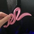 Glossy bright pink wavy hair claw clip held by hand for daily hairstyling styling - Rose Red Wave Claw Clip