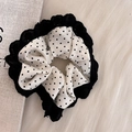 Elegant black lace and white polka dot bow scrunchie on light wood table - White Scrunchie With Black Polka Dots