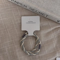 Macro shot of two-tone braided spiral hair tie in grey and cream on a display card - Spiral Hair Ties Pair / Blue