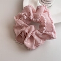 Detail view of pink lace scrunchie with dot patterns and delicate pleated chiffon fabric - Pink