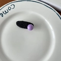 Sweet purple pearl hair clip with black tweed texture ribbon on a white porcelain dish - #13 Black Oval with Pink Ball