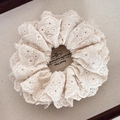 Macro view of high-quality floral embroidery and lace texture on a beige scrunchie - Cream White Leaf Small Hollow Scrunchie