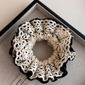 Detailed close-up of double-layer lace scrunchie with French retro style in black and white - Black