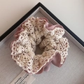 Detailed close-up of double-layer pink chiffon and beige lace floral hair scrunchie - Pink