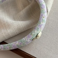 Detailed macro view of the purple floral fabric headband with a white camellia flower - Purple Textured Headband Yellow Flower