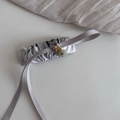 Detail of silk ink-wash hair ribbon with faux jade pendant and gold metal hardware - Gray Pleated Bow BB Clip