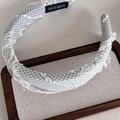 Detail of light green plaid headband with lace trim and hand made label on wooden tray - Green Plaid Lace