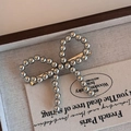 Fermaglio per capelli a fiocco con perline metalliche argentate in stile balletto - Anello Fiocco Perla Argento