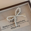 Elegante fermaglio per capelli con perle a fiocco e base in metallo argentato - Fiocco di Perle Bianco
