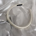 Detailed close-up of cream satin headband with handmade label and glossy finish - Glossy Cream White (4#)