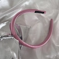 Detailed shot of pink satin headband featuring a black handmade label on soft silk cloth - Glossy Dark Pink (3#)