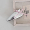 Close-up of silver leather BB hair clip with a delicate pink ribbon bow detail - Silver Triangle Pink Bow