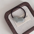 Minimalist elastic hair tie with grey resin heart charm on a rustic wooden tray - Heart Hair Tie / Gray