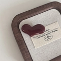 Close-up of deep red heart hair clip with high-gloss finish on a vintage wooden tray - Heart Hair Clip Set / Brown