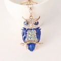 Golden owl keychain pendant with blue enamel wings and sparkling crystal rhinestones - Blue
